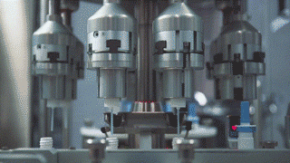 a machine filling and sealing ophthalmic medicine in a sterile bottle